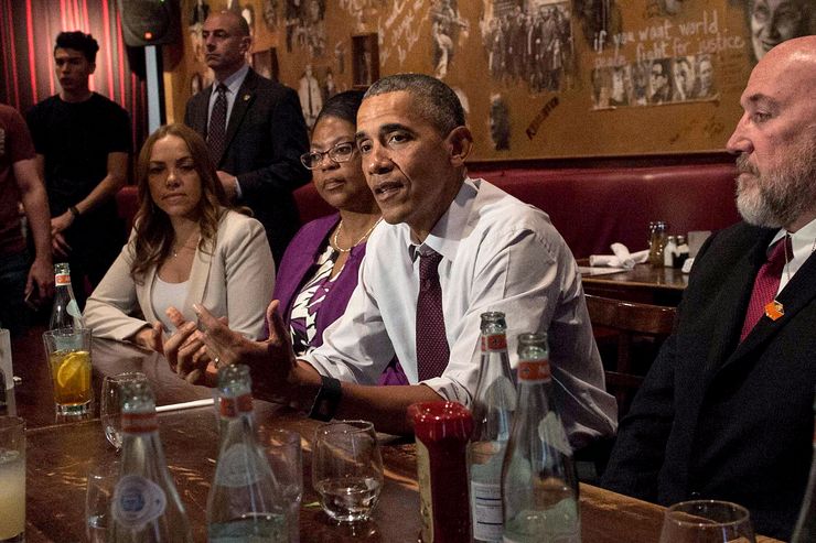 US President Barack Obama meets with formerly incarcerated individuals who have previously received commutations in Washington, DC, on March 30, 2016...From L to R, Serena Nunn, Ramona Brant, Obama, Phillip Emmert, Angie Jenkins and Kemba Smith. President Barack Obama on Wednesday commuted the sentences of 61 individuals charged mostly with cocaine-related offenses, as he again pressed the case for drug sentencing reforms.. / AFP / NICHOLAS KAMM        (Photo credit should read NICHOLAS KAMM/AFP/Getty Images)