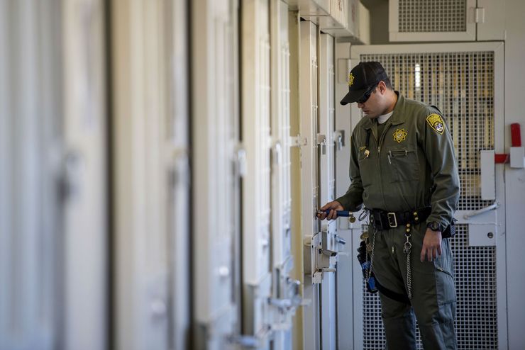 A corrections officer checks a death row cell at San Quentin State Prison in California.