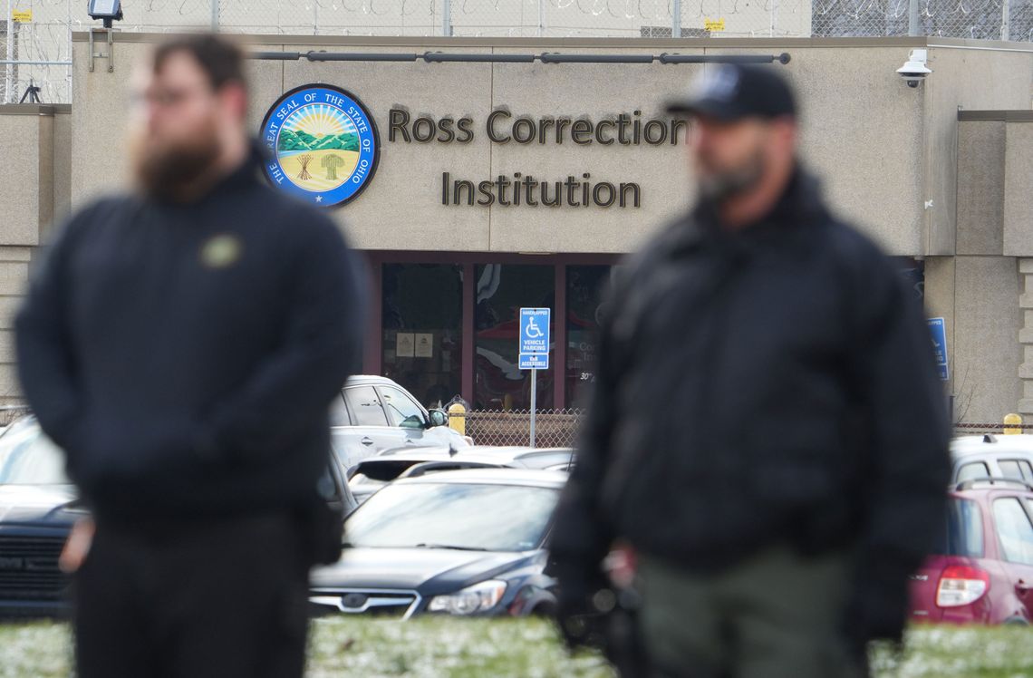 Ohio Department of Rehabilitation and Correction staff members gather on Jan. 3 for Andrew Lansing’s funeral procession as it passes by Ross Correctional Institution. Authorities say Lansing, a correctional officer, was killed by an incarcerated man last month.