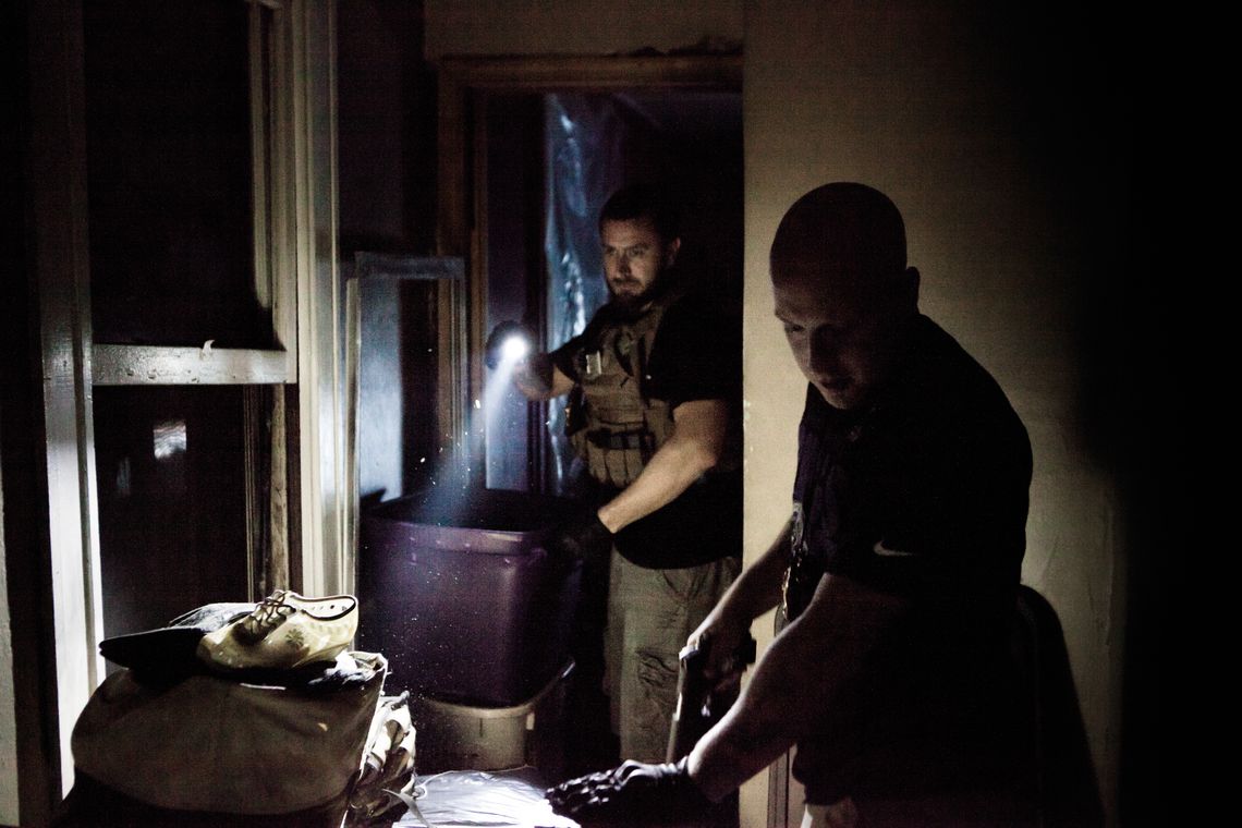 Bondsmen enter a defendant’s home in the Bronx. 