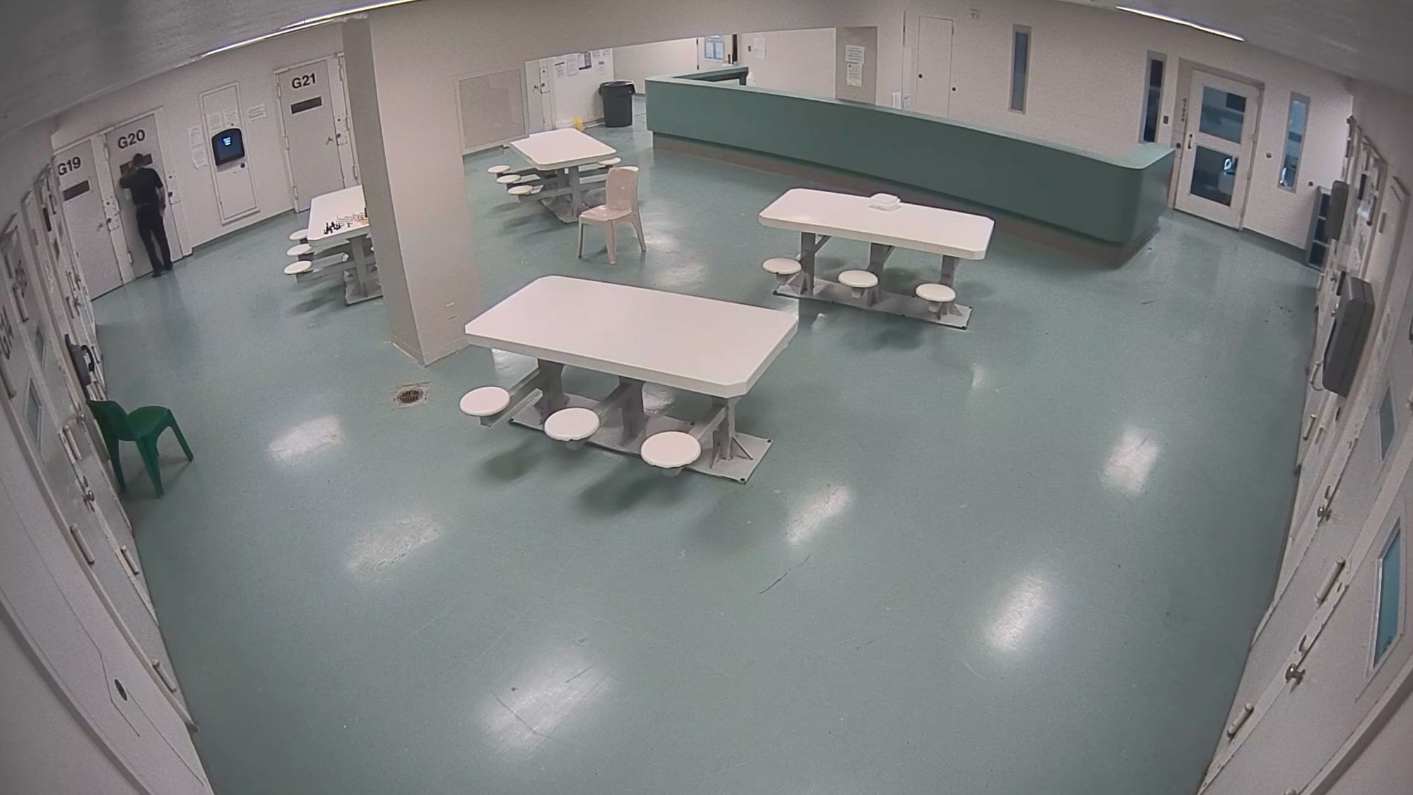 Three still images from surveillance footage show a jail pod. The first image shows a correctional officer looking into a cell. The second image shows the officer on the other side of the pod. The third image shows a group of officers and nurses outside an open cell door with a gurney. 
