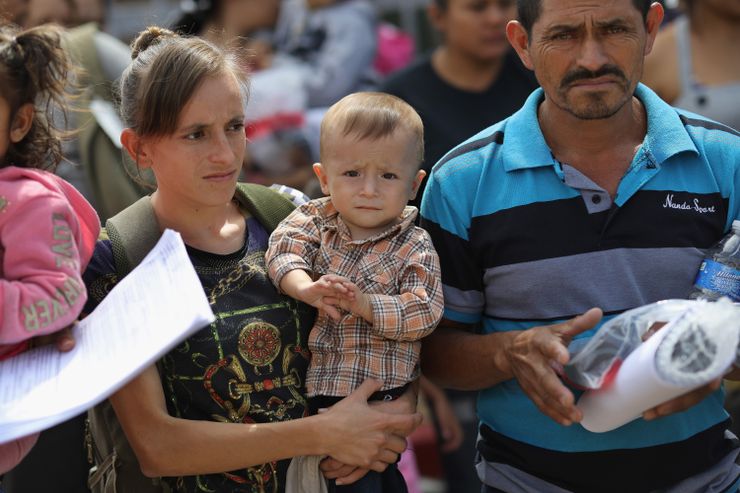 Migrant families from Central America are released at the border with orders to appear for future hearings in immigration court, on June 11, 2018 in McAllen, Texas. 