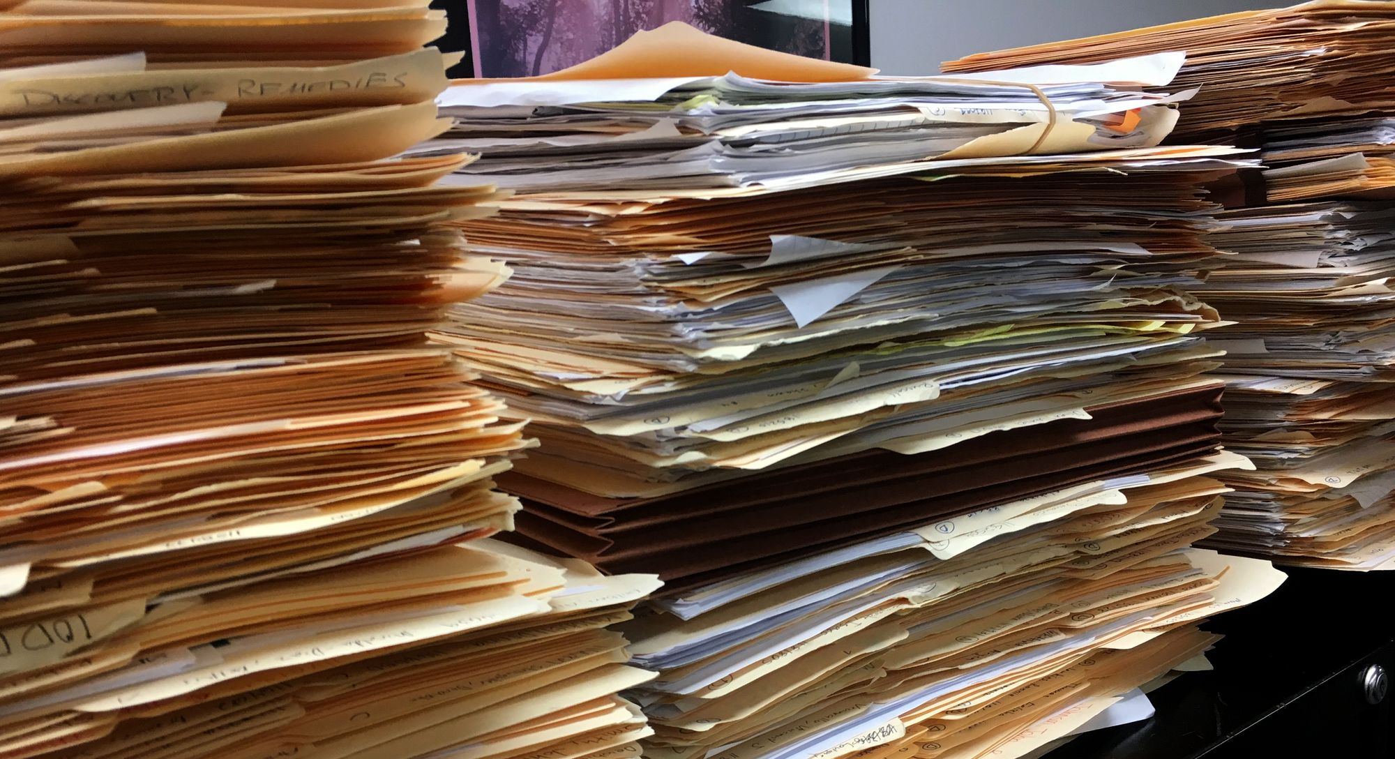 Case files stacked atop file cabinets at the Orleans Public Defenders office in New Orleans, La. 