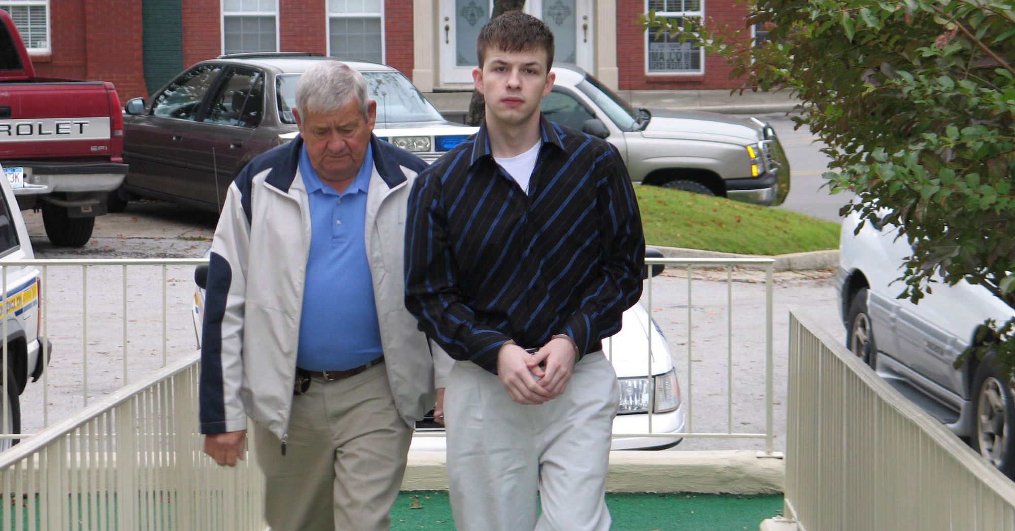 Evan Miller, right, was escorted to the Lawrence County Courthouse in Moulton, Ala., in 2006. In April 2021, he was resentenced to life without parole for the 2003 murder of Cole Cannon.