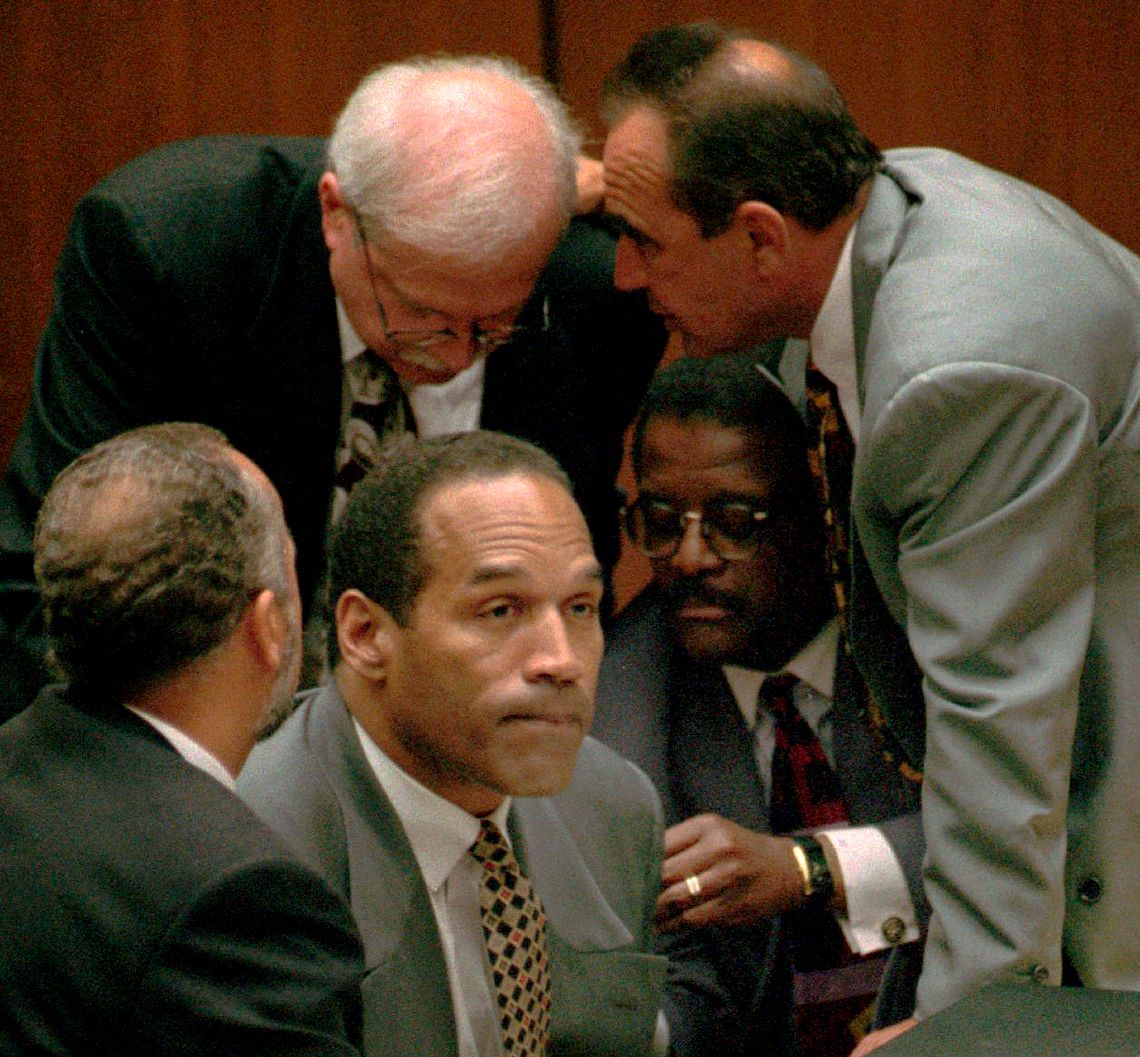 O.J. Simpson surrounded by his attorneys, clockwise from left, Ken Spaulding, Gerald Uelmen, Robert Shapiro and Johnnie Cochran Jr., during his double-murder trial in Los Angeles in 1995. 