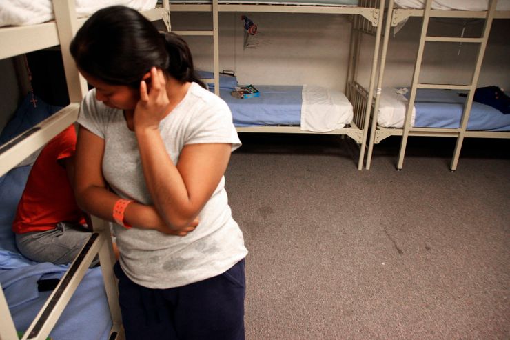 An unidentified woman from Guatemala stands inside a dormitory in the Artesia Family Residential Center, an Immigrations and Customs Enforcement detention center in New Mexico, in 2014.