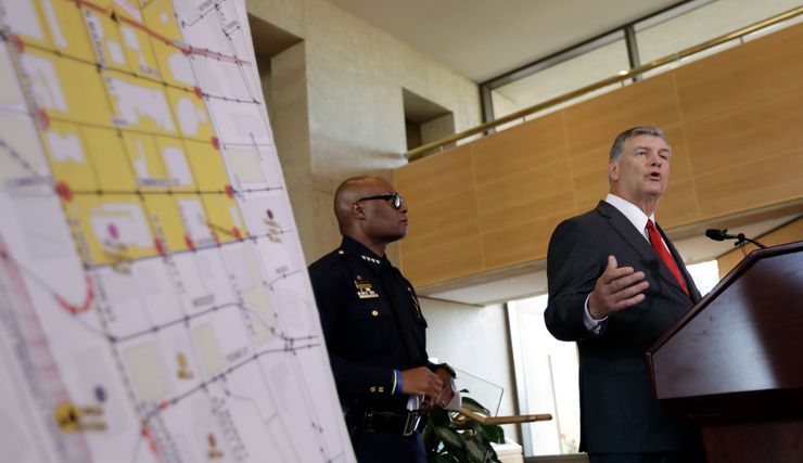 Dallas Police Chief David Brown, left, and Mayor Mike Rawlings at a news conference on Friday following a sniper attack that left five police officers dead.