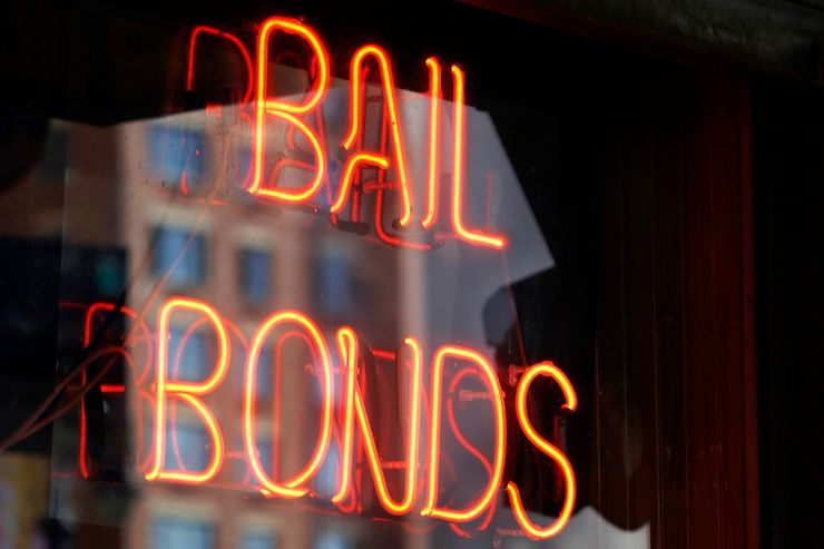 A bail bonds business is shown near Brooklyn’s courthouse complex and jail in New York, Tuesday, July 7, 2015.  (AP Photo/Kathy Willens)