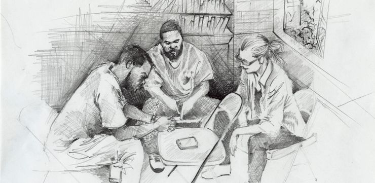 From left to right, Antwan Williams, Earlonne Woods, and Nigel Poor, co-creators and co-producers of the “Ear Hustle” podcast, conduct an interview by cell phone at San Quentin Prison.