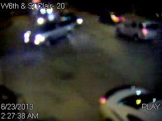 A screenshot of surveillance video showing a vehicle turning to its right.