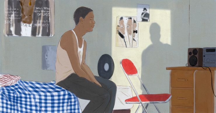 A Black man wearing a white tank and gray pants sits on a bed with a blue-checked pattern. On the right is a desk with a stereo on it. On the wall are a poster and a Rolling Stone magazine cover showing Sean "Diddy" Combs. Also on the wall, you can see the shadow of a person in a doorway.