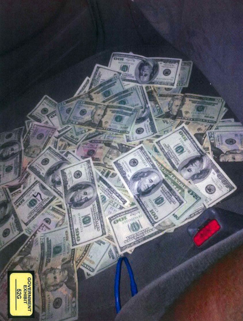 A number of photos were recovered from David Lewisbey’s cell phone, including photos of thousands of dollars in cash, 