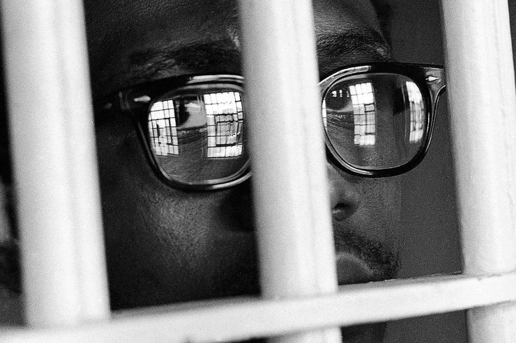 Aaron Thomas, 23, of Opelousas, LA., convicted of murder and sentence to death before the U.S. Supreme Court...s ruling on the death penalty as unconstitutional, looks through the bars of his cell on death row at the Louisiana State Prison in Angola, Louisiana on August 3, 1974. He is appealing his case but has not asked for re-sentencing. (AP Photo/Jack Thornell)