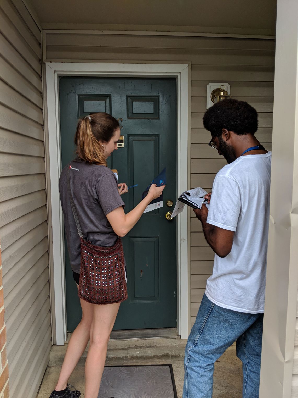 Sean Champagne and Ellen Boettcher, Alabama Voting Rights Project fellows, canvassing in Montgomery in August 2018. They told residents about the change in the Alabama law that allows many people with convictions who previously could not vote to get registered.