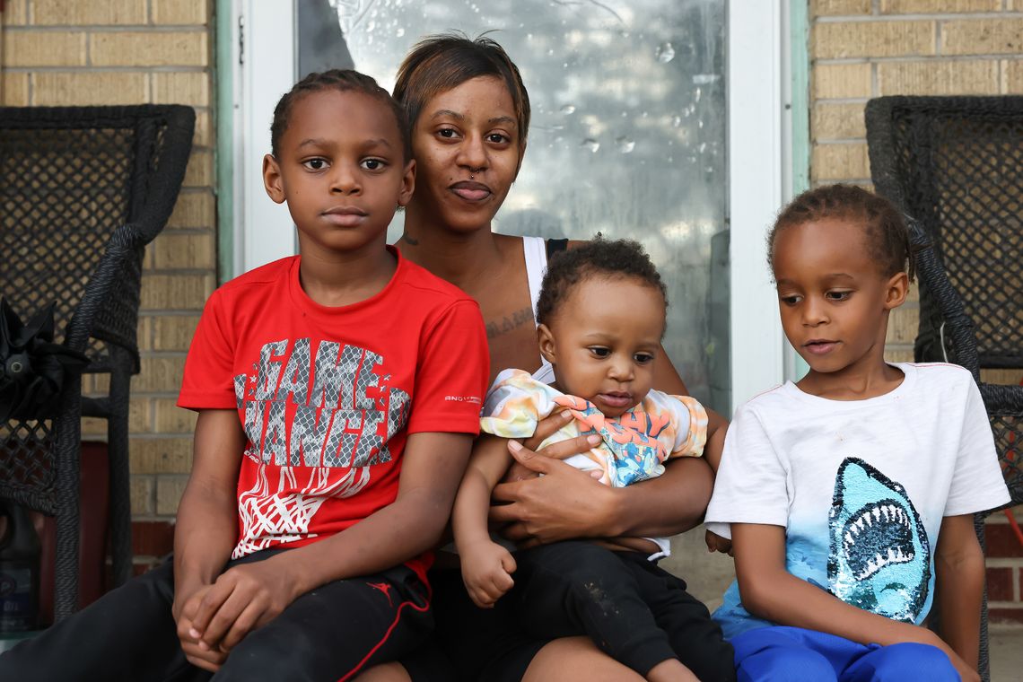 Vanessa Peoples poses for a portrait with her sons Tamaj (7), Mahjae (6) and Zamari (11 months) outside her home in Aurora, CO, May 13, 2021.