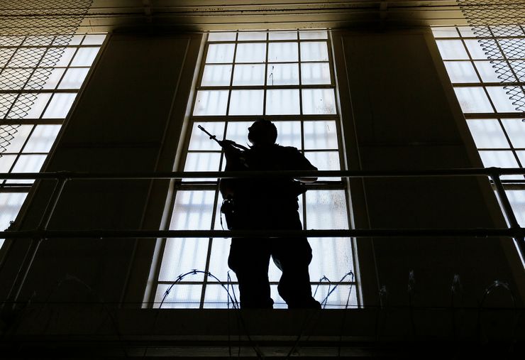 A guard stands watch over the east block of death row at San Quentin State Prison in California in 2016.