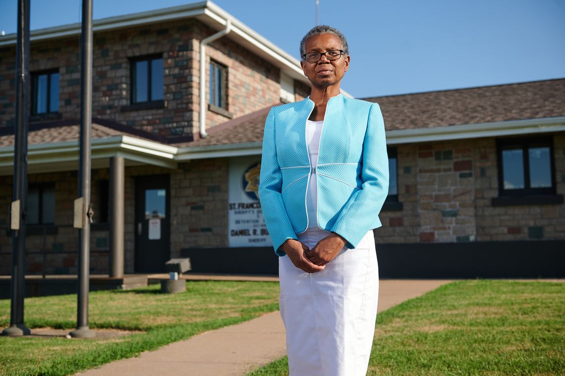 Vonne Karraker, a lawyer in Farmington, Mo., has become the face of the local resistance against the St. Francois County Jail, pictured behind her. 
