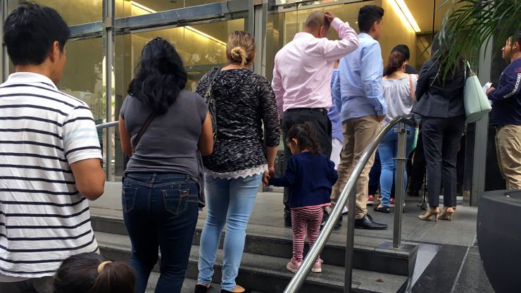 People line up outside the building that houses the immigration courts in Los Angeles in 2018.