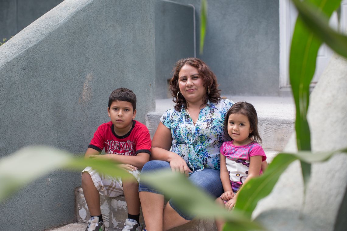 María Arita and her children, Amilcar, left, and Allison, at their home in Charlotte. Arita came to the U.S. from Honduras in 2013 with her then-3-year-old son to escape a gang that was targeting her family.