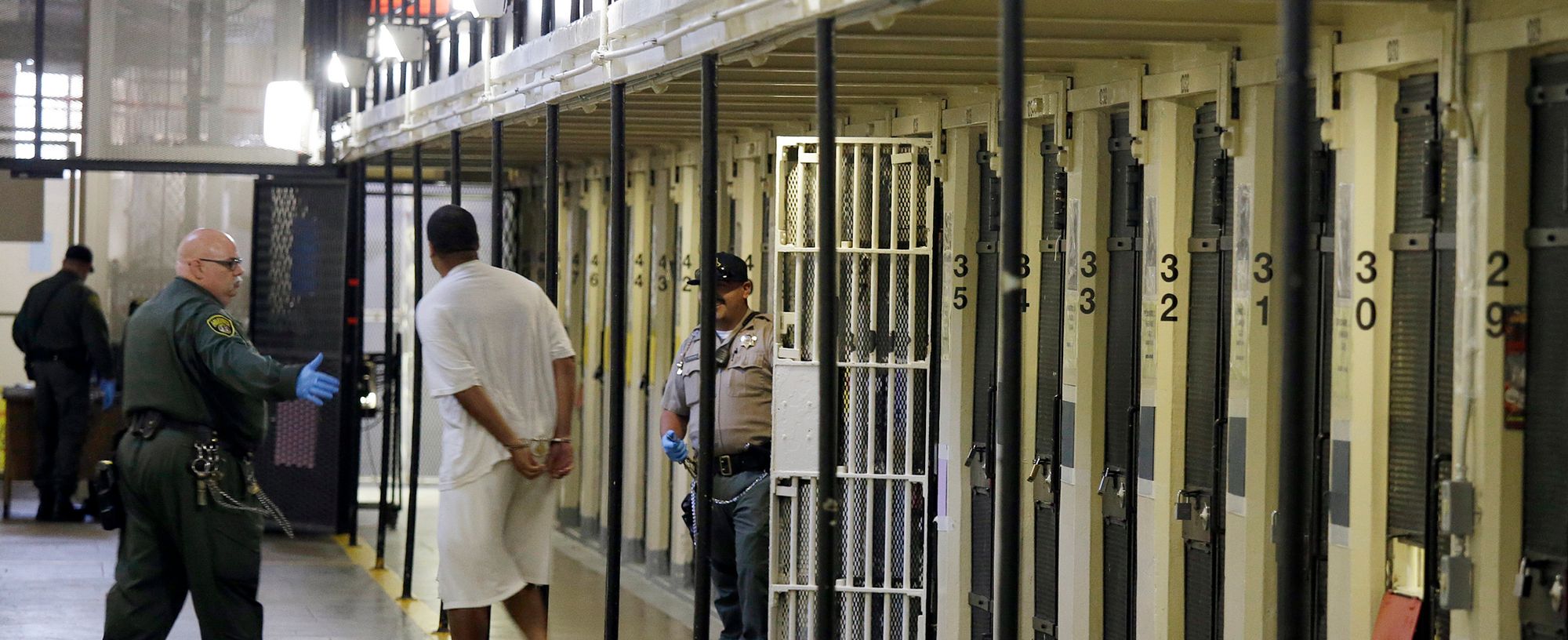 A condemned inmate is led out of his cell on death row at San Quentin State Prison in San Quentin, California in 2016.