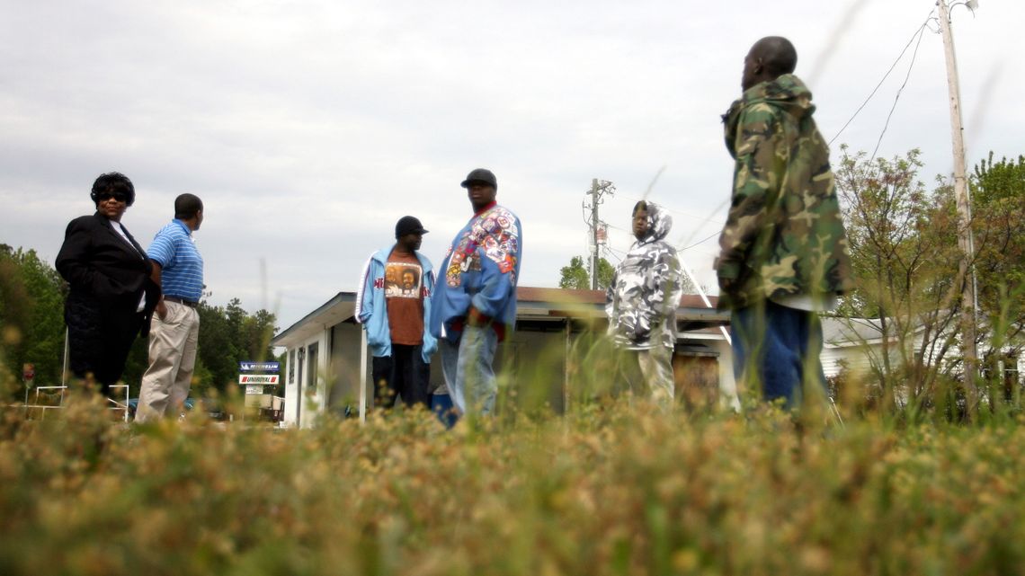 Members of Issac Bailey's family in 2007 at the location where Moochie killed James Bunch. Issac is standing next to his mother, Elizabeth McDaniel, left. 