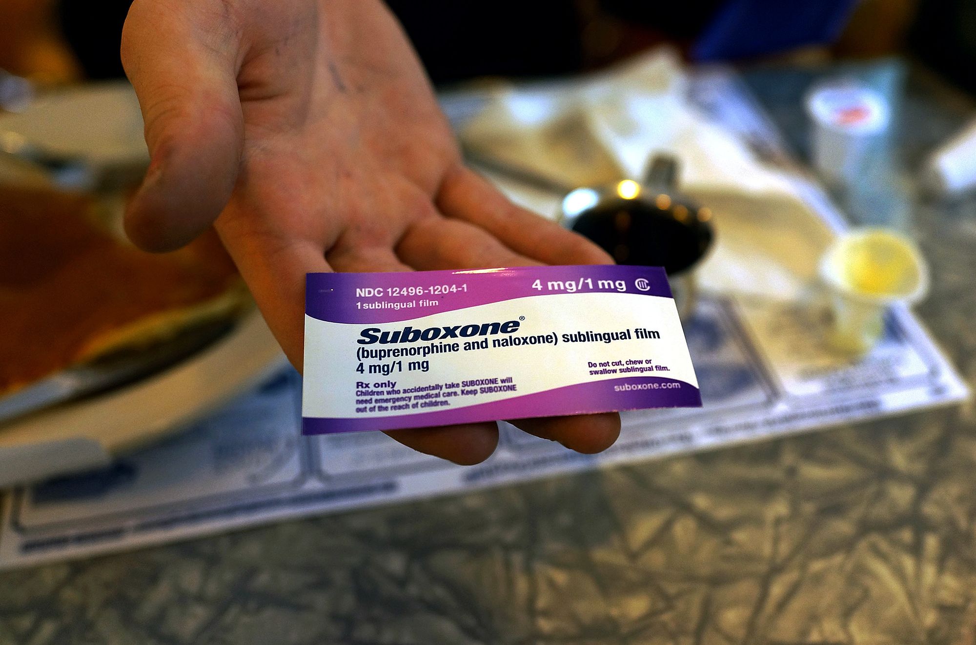 A recovering heroin addict shows his prescription of Suboxone, a maintenance treatment for opioid dependence, in Burlington, Vt. in 2014. 