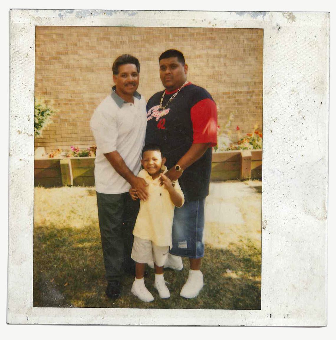 Reynaldo Rodriguez, left, with his son, right, and his grandson in 2002. Rodriguez has been in prison since his son was two years old. 
