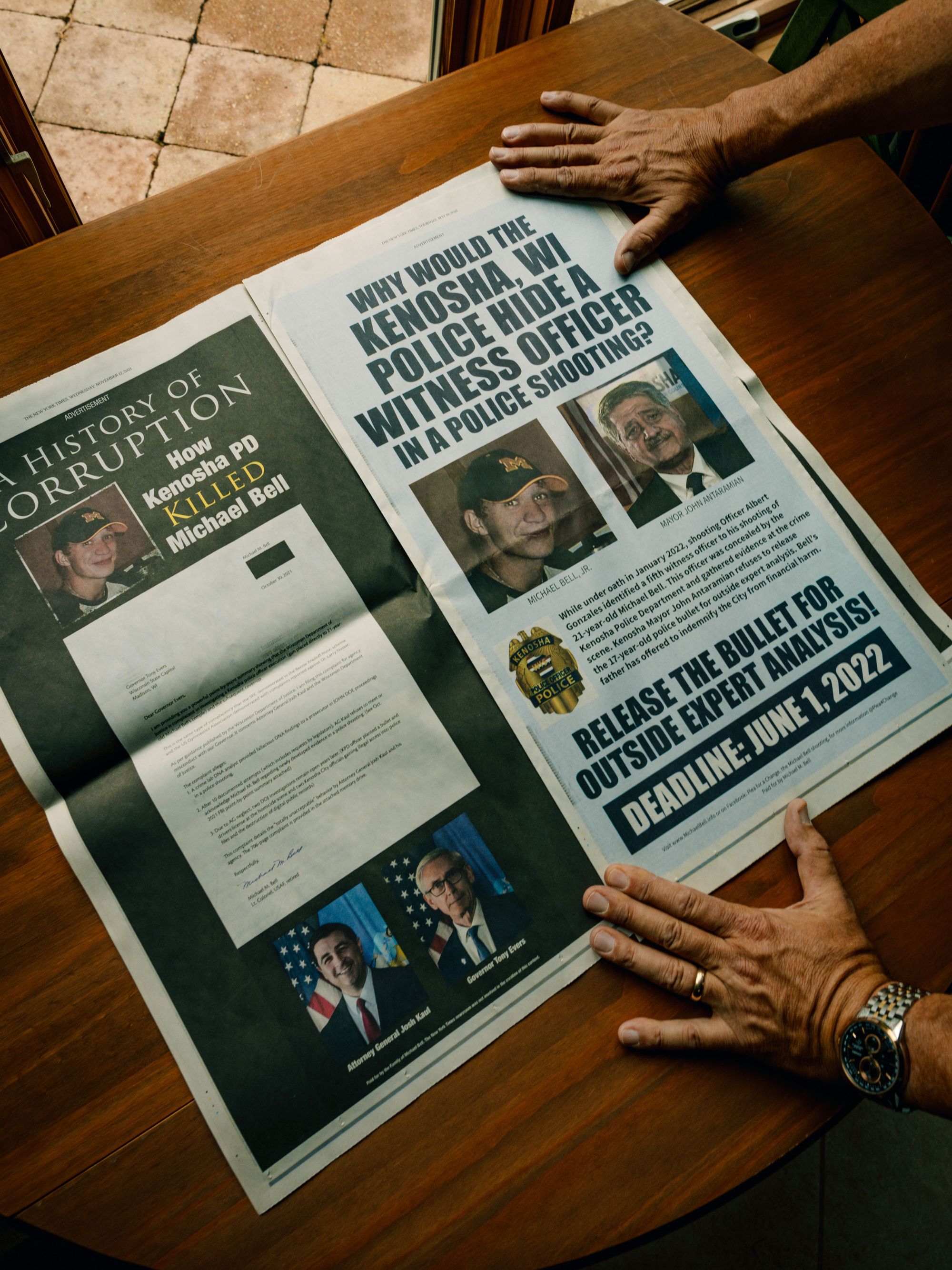 Two full page ads in The New York Times show Michael Bell Jr.'s photo, Wisconsin Attorney General Josh Kaul, Gov. Tony Evers, and Kenosha Mayor John Antaramian. Some of the words read: "A History of Corruption: How Kenosha PD Killed Michael Bell," and "Why would the Kenosha WI police hide a witness officer in a police shooting," and "Release the bullet for outside expert analysis!"
