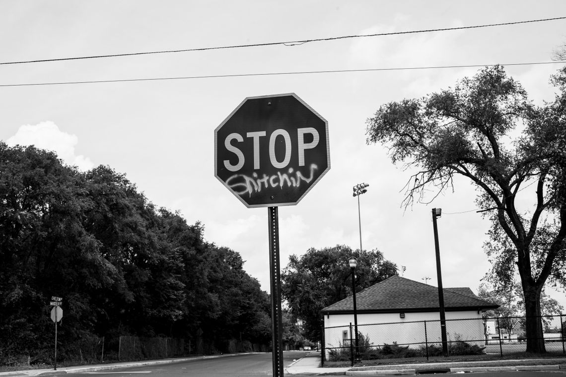 A stop sign reads “Stop Snitchin” on the corner of Master Street and Chelton Avenue in Camden on Aug. 8, 2013. 
