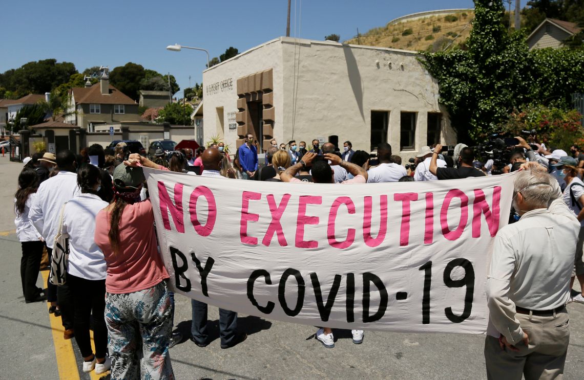 A group of legislators, advocates, academics and public health officials gathered outside San Quentin State Prison in California to discuss a COVID-19 outbreak at the facility in July. 