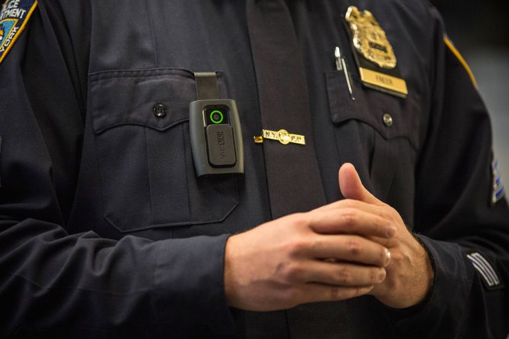 A New York Police Department Sergeant demonstrates how to operate a body camera during a press conference in December. 
