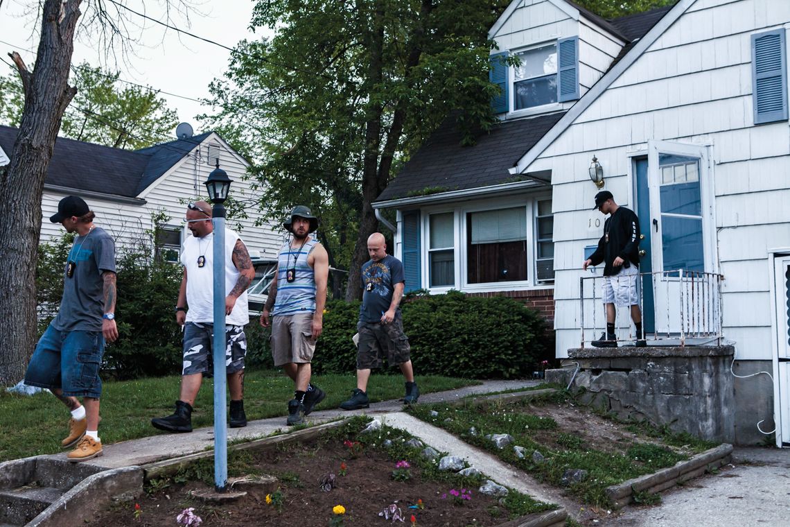 Bounty hunters leave the house of a fugitive’s relative in Baltimore County, Md.