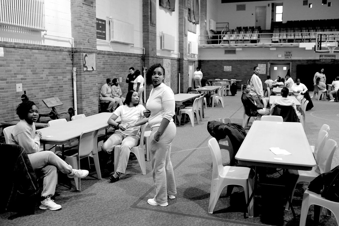 From left, Lakeisha, Carmelita Hall and Shakyla wait for their families.