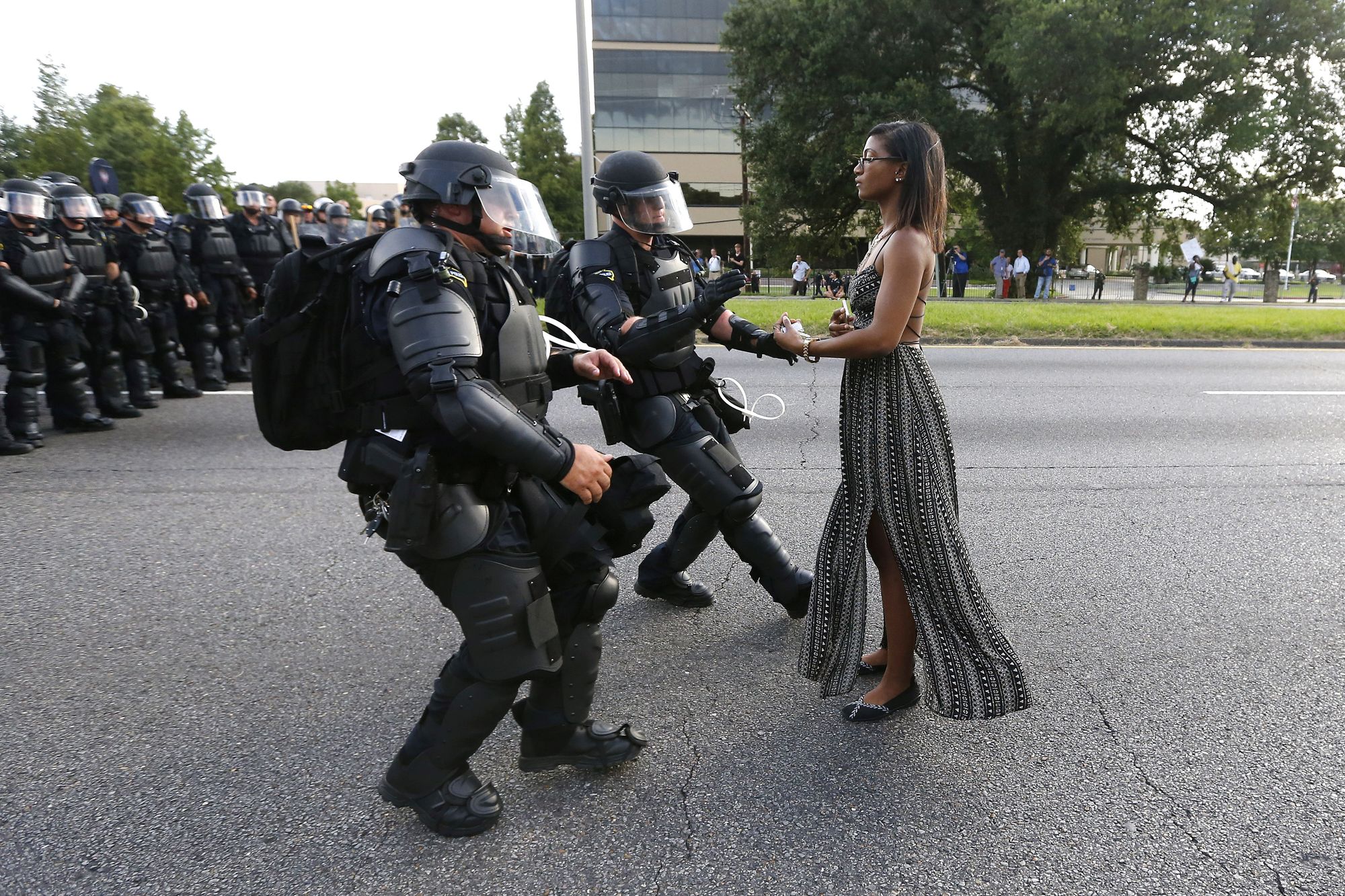 A demonstrator protesting the shooting death of Alton Sterling is detained by law enforcement near the headquarters of the Baton Rouge Police Department in Baton Rouge, La., July 9, 2016.