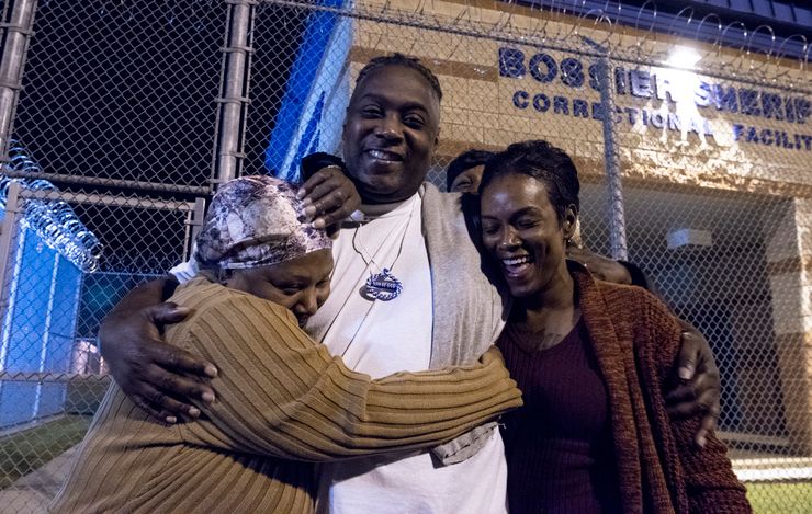 Bernard Noble hugs Elnora Noble, his mom, and Gwynne Noble his sister, outside of Bossier Parish Medium Security Prison early Thursday morning. 