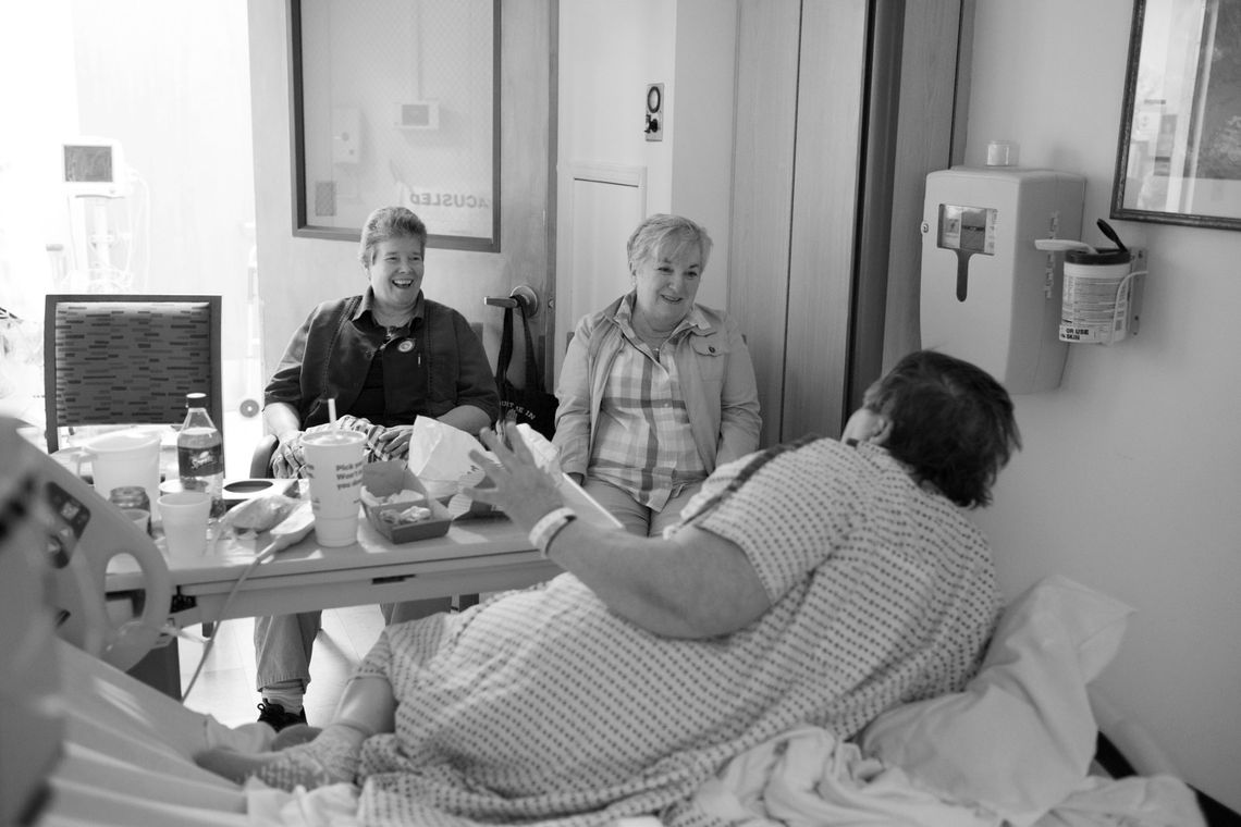 Carol had two heart attacks in prison. Her friends, Kelly, left, and Tina visit her at Mount Sinai Medical Center in Long Island City where she receives treatment for heart disease. 