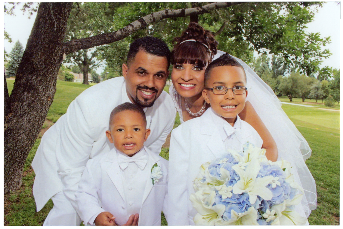 Rene and Jasmine on their wedding day in June 2013 with their son Josiah, left, and Jasmine’s son Justus. 
