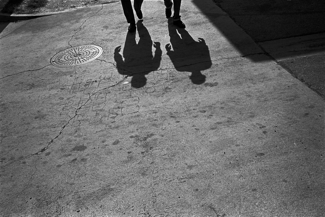 Two ex-gang members walk the streets of South Central. (Los Angeles, 1993)