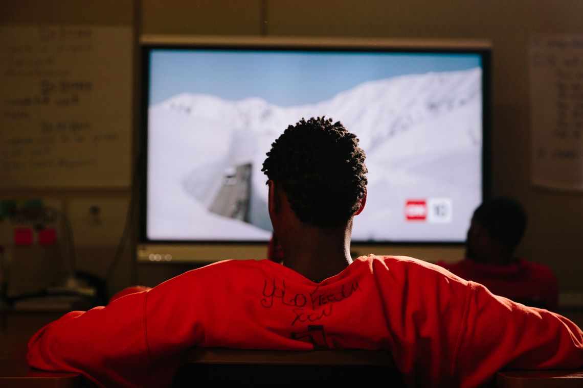 A student watches a CNN segment during social studies class.
