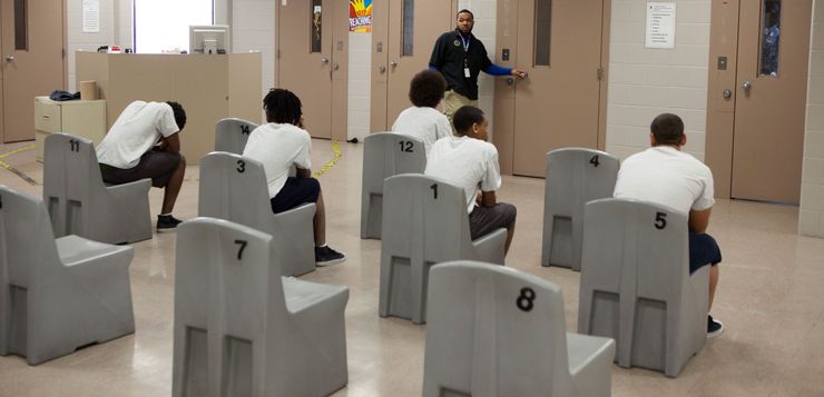 Juvenile offenders wait to go to the gym inside the Lucas County Juvenile Detention Center in Toledo, Ohio.