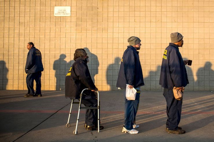 VACAVILLE, CA - DECEMBER 16: (Editorial Use Only) George Whitfield (sitting), age 56, waits in line to receive his daily blood pressure at California State Prison, Solano, on December 16, 2013 in Vacaville, California. This is Whitfield’s fourth time in prison - his current sentence is six years. He was sentenced for possession of narcotics with intent to sell and an illegal firearm. Whitfield denies the charges, saying police searched his house without presenting a warrant and only found marijuana that he used personally and a firearm he kept in his home. His previous three sentences, dating back to 1989, were allegedly for possession of marijuana, which he says he has only used recreationally. According to Whitfield, he suffered a stroke in 2007, which now forces him to use a walker. He also suffers from high blood pressure and has recently experienced numbness in his left arm. While Whitfield believes the prison officials at Solano are “fair, they’re only doing their job,” he also laments, “they should have sent me to rehab...they’re not trying to save my life, they’re trying to ruin it.” He continued, “I believe in second chances, I would love to see [some of my fellow inmates] go home - they don’t belong in here. This is overkill....we’re still human.” As of June 2013,  the state of California had 133,000 prisoners, of which approximately 15,000 were over the age of 55. According to a 2012 Human Rights Watch Report, “incarcerated men and women typically have physiological and mental health conditions that are associated with people at least a decade older in the community. The U.S. incarcerates more people than any other country, with the number of inmates increasing 42 percent between 1995 and 2010, according to Human Rights Watch, and the number of prisoners 55-and-older skyrocketing by 282 percent. The increases are blamed on the ‘tough on crime’ and the ‘war on drugs’ policies enacted in the 1970s through the 1990s. (Photo by Andrew Burton/Getty Images)