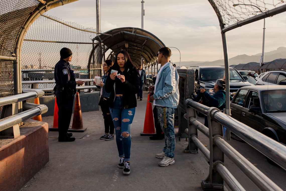 Ana Castañeda and Lluvia Rodriguez are cheerleaders at Bowie High School in El Paso. The school is a stone's throw from the border wall and has deep roots in the immigration debate. Many of its students are American citizens who cross the border from Mexico each day to attend school.