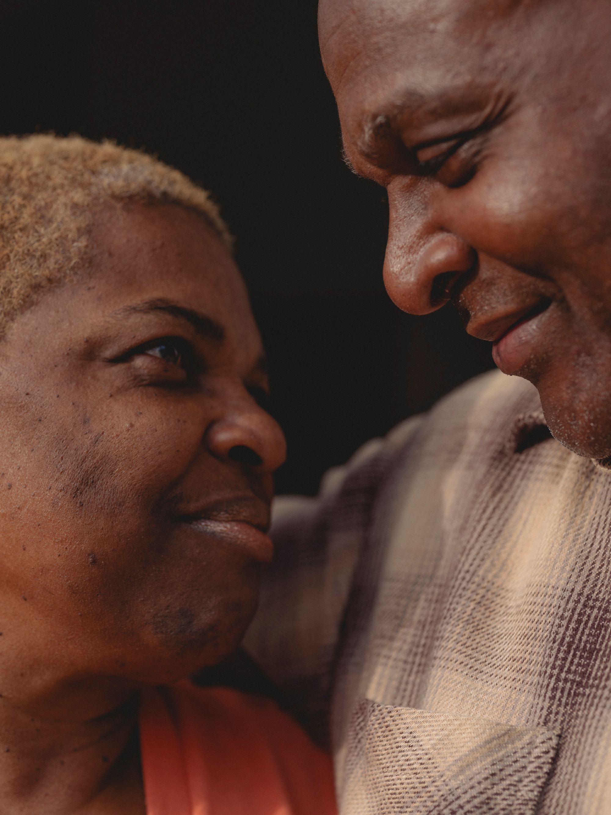 A closeup of Raymond looking lovingly at Cassandra.