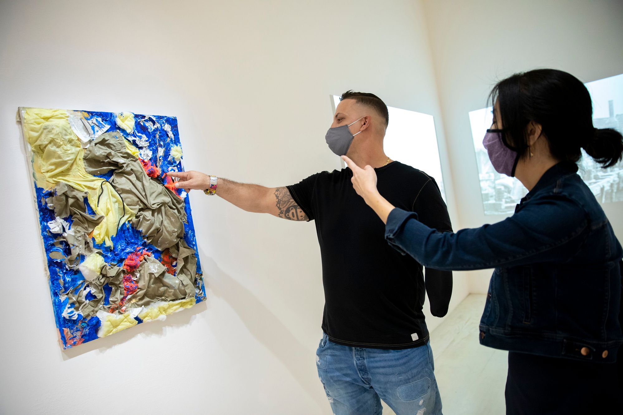 At the MoMA PS1 exhibit "Marking Time: Art in the Age of Mass Incarceration," artist Gilberto Rivera shows Helena Huang of the Art for Justice Fund his 2012 work "An Institutional Nightmare." 