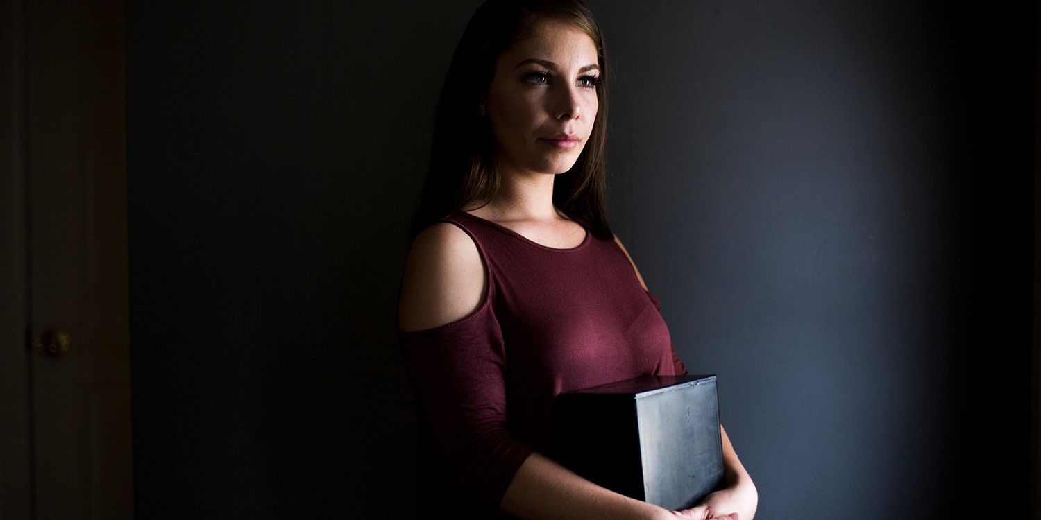 Kimberly Heraldez holds her father, Kevin Ziech’s ashes for a portrait at her home in Bakersfield, CA., on Thursday, Nov. 16, 2017. Ziech died only a few days after his compassionate release from prison. (Jenna Schoenefeld for The New York Times) NYTCREDIT: Jenna Schoenefeld for The New York Times