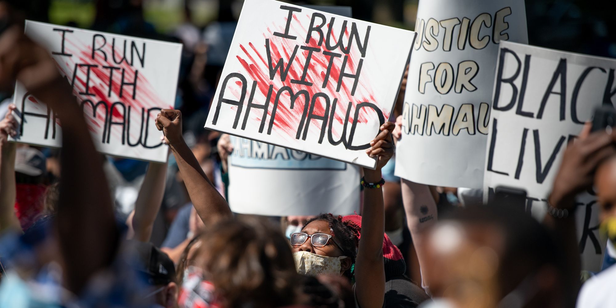 Demonstrators protest the shooting death of Ahmaud Arbery at the Glynn County Courthouse in Brunswick, Georgia, on May 8. Gregory and Travis McMichael were arrested the previous night and charged with murder.