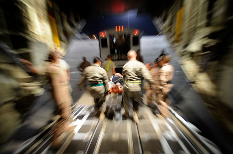 U.S. Air Force airmen transport patients from a military plane to an ambulance during a medical evacuation mission in Afghanistan in 2009.